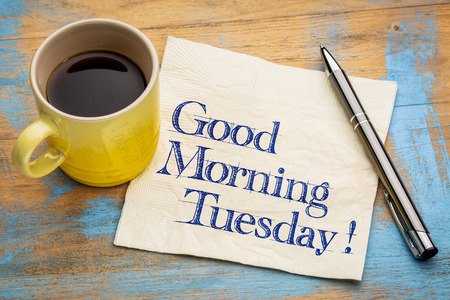 Good Morning Tuesday - handwriting on a napkin with a cup of espresso coffeeの写真素材