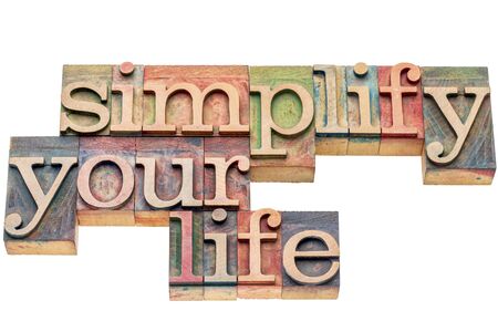 simplify your life advice -  isolated word abstract in letterpress wood typeの写真素材