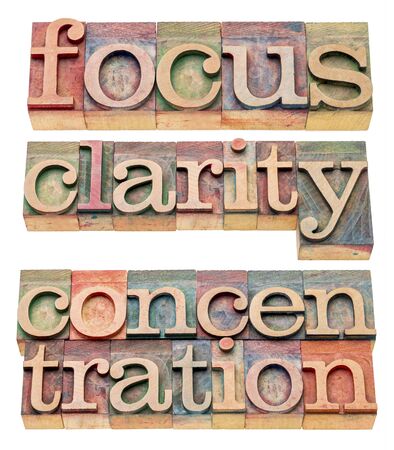 focus, clarity and concentration isolated words  in letterpress wood typeの写真素材
