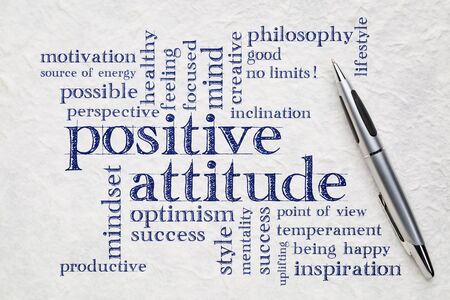 positive attitude word cloud - handwriting on a white lokta paper wit a penの写真素材