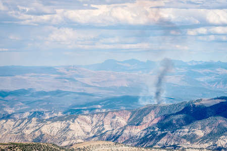 smoke plume from controlled forest burn in White RIver National Forest, Rocky Mountains, Coloradoの写真素材