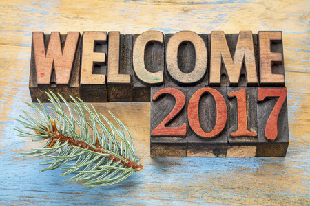 welcome 2017 - word abstract in vintage letterpress wood type blocks stained by color inksの写真素材