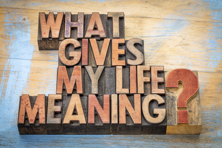 What gives my life meaning? - Word abstract in vintage letterpress wood type blocksの写真素材