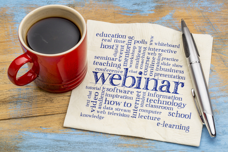 webinar (web seminar) word cloud  - handwriting on a napkin with a cup of coffeeの写真素材