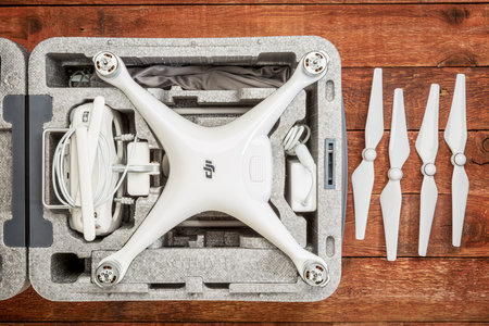 FORT COLLINS, CO, USA - DECEMBER 11, 2016:  DJI Phantom 4 pro quadcopter drone in a custom case on a...