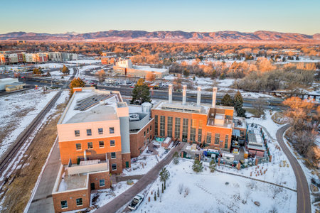 FORT COLLINS, CO, USA - DECEMBER 24, 2016: Powerhouse Energy Campus of Colorado State University - a new building completed in 2014 and historic Municipal Power Plant, aerial view at winter sunrise.のeditorial素材