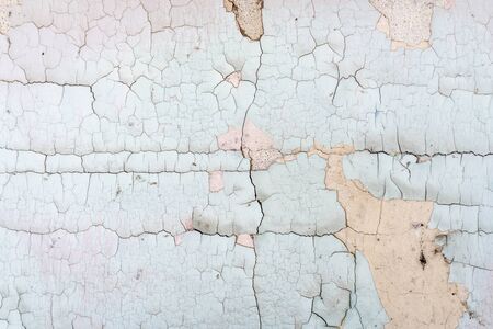 old plaster wall background and texture with holes and cracks