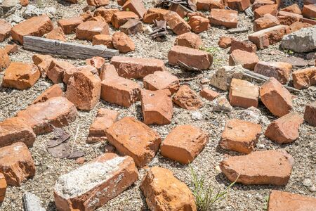 broken bricks and trash at abandoned industrial siteの写真素材