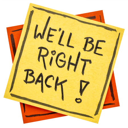 We will be right back - handwriting on an isolated sticky noteの写真素材