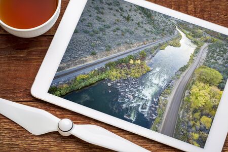 Rodeo Rapid on the upper Colorado River at Burns, Colorado, USA, - reviewing and editing aerial image on a digital tabletの写真素材
