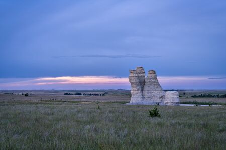 Castle Rock at dusk - limestone pillar landmark in prairie of western Kansas near Quinter (Gove County), late summerの写真素材
