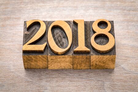 2018 year in vintage  letterpress wood type against grained woodの写真素材