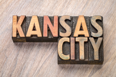 Kansas City word abstract in vintage  letterpress wood type against grained wooden backgroundの写真素材