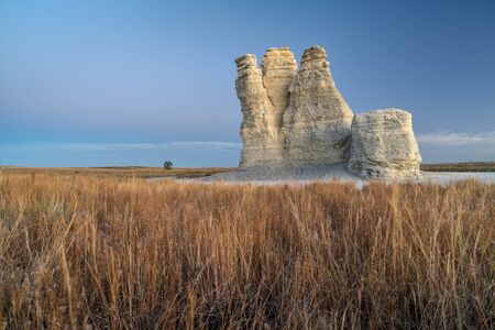 limestone pillar landmark in prairie of western Kansas near Quinter (Gove County), windy fall morning before sunriseの写真素材