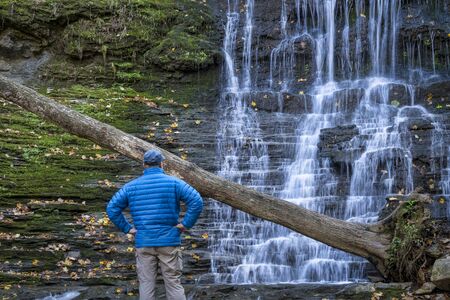 a male visitor at Jackson Falls at Natchez Trace Parkway, fall sceneryの写真素材