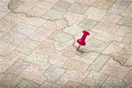 a lower Missouri River across the state of Missouri on vintage 1920s map  with a red pushpin on Jefferson City, digital painting filter appliedの写真素材