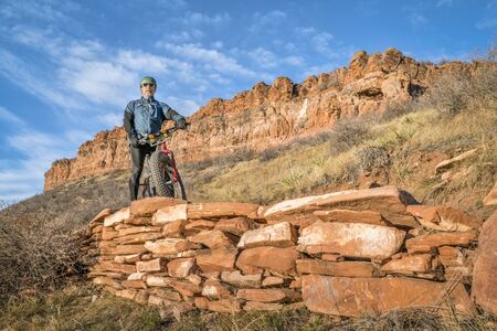senior cyclist with a fat bike on Blue Sky Trail near Fort Collins, Colorado, fall sceneryの写真素材