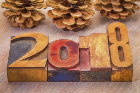 2018 year word abstract in vintage  letterpress wood type woth pine cones, digital painting effect appliedの写真素材