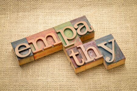 empathy word abstract in letterpress wood type against burlap canvasの写真素材