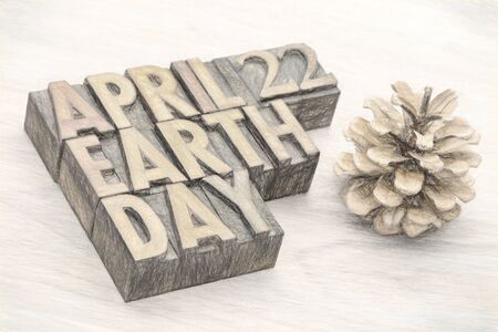 April 22, Earth Day - word abstract in letterpress wood type printing blocks with a digital painting...