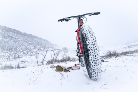 A fat bike in a snow blizzard at Colorado foothills - Lory State Parkの写真素材