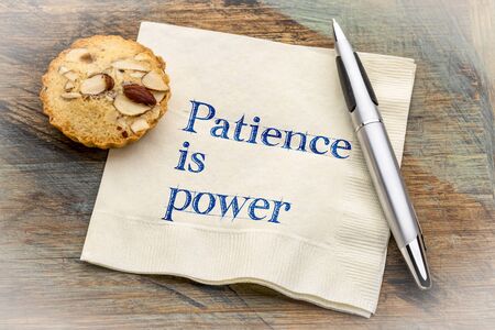 Patience is power - inspiraitonal handwriting on a napkin with a cookie