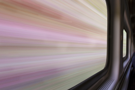 blurred abstract landscape of a sandstone canyon seen from a  train window in motion - travel...
