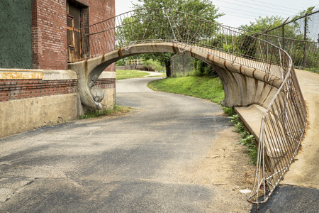 St Louis Riverfront Trail under a footbridge in old industrial area along the MIssissipi River,の写真素材