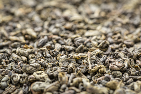 Background texture of loose leaf Gunpowder  green tea, selective focusの写真素材