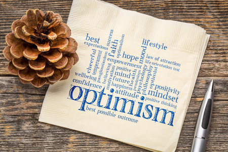 Optimism word cloud - handwriting on a napkinの写真素材