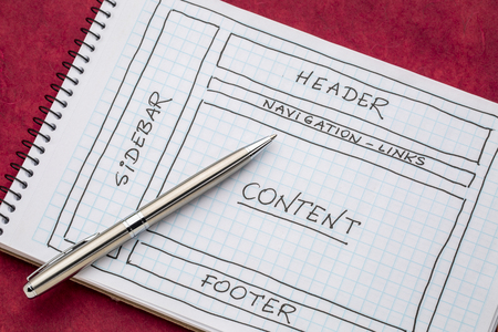 designing website layout - a sketch in a spiral notebookの写真素材