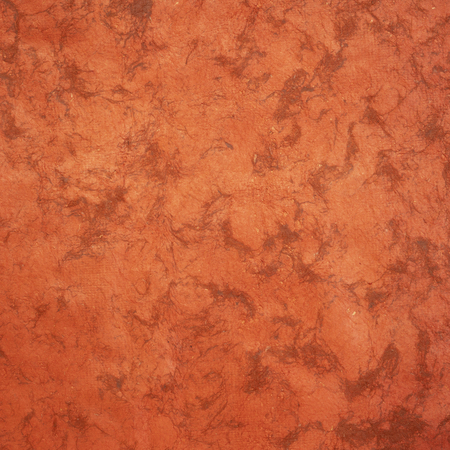 background of pumpkin orange Huun Mayan handmade paper created  by Mayan artisans throughout the Yucatan Peninsula of Mexicoの写真素材