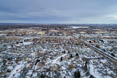 winter dusk over city - aerial view of residential and shopping areas of Fort Collins in northern Coloradoの写真素材