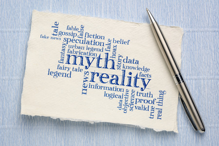 myth versus reality word cloud - handwriting on a sheet of rough Khadi paperの写真素材