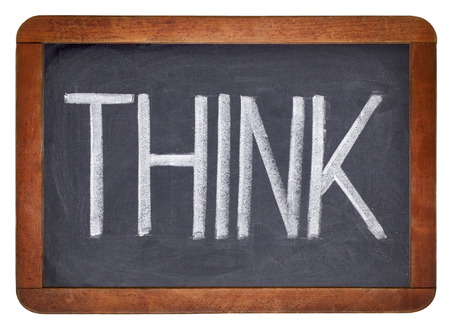 think word - big letters in white chalk on isolated vintage blackboardの写真素材