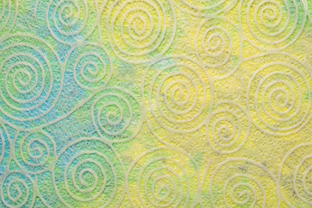 Japanese Washi tissue with white Uzumaki pattern spirals against marbled mulberry paperの写真素材