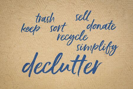 declutter and simplify  word cloud - handwriting on a handmade bark paper