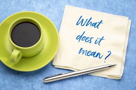 What does it mean? Handwriting on a napkin with a cup of coffee.の写真素材
