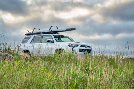 Fort Collins, CO, USA - August 16, 2019: Toyota 4Runner SUV with a performance stand up paddleboard on a shore of Horsetooth Reservoir.のeditorial素材