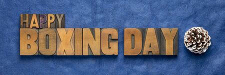 Happy Boxing Day word abstract in vintage letterpress wood type with pine cone, greeting cardの写真素材