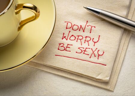 do not worry, be sexy - inspirational handwriting on a napkin with a cup of coffee, pep talk,...