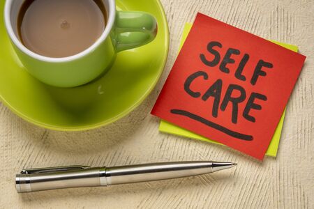 self care reminder note with coffee - health, wellbeing and lifestyle concept