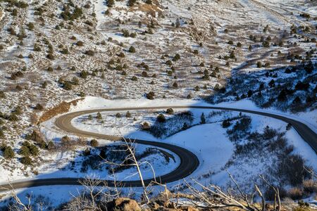scenic windy mountain road in winter scenery - La Sal Mountain Loop near Moab Utah, travel and...