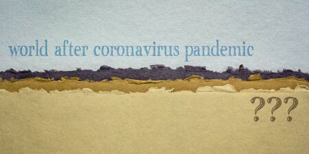 world after coronavirus pandemic question - writing on a handmade rag paper, changes and uncertainty due to global covid-19 outbreakの写真素材