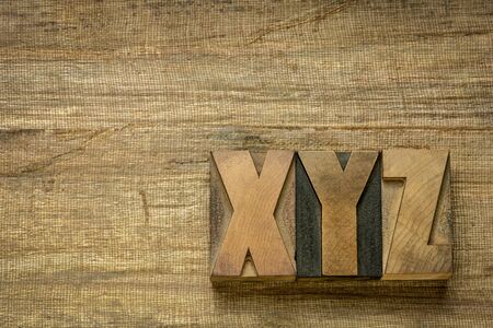 xyz - last letter of alphabet in vintage letterpress wood type against grunge banana paperの写真素材