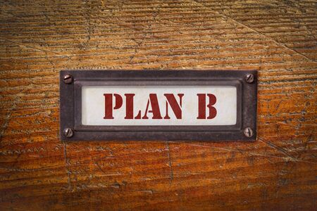 plan B - file cabinet label, change of business and personal plans due to coronavirus pandemic and market recessionの写真素材