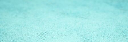 background and texture of blue huun handmade paper with a selective focus, long web bannerの写真素材