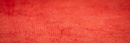 background and texture of red huun handmade paper with a selective focus, panoramic web abnner
