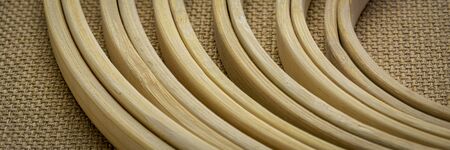 set of bamboo embroidery hoops against burlap canvas, craft and hobby concept, panoramic web bannerの写真素材