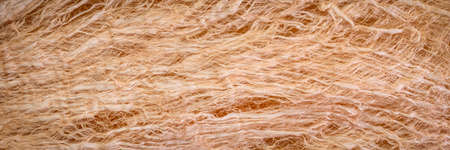 raw, natural mulberry paper handmade in Thailand - background and texture of fibers, panoramic...